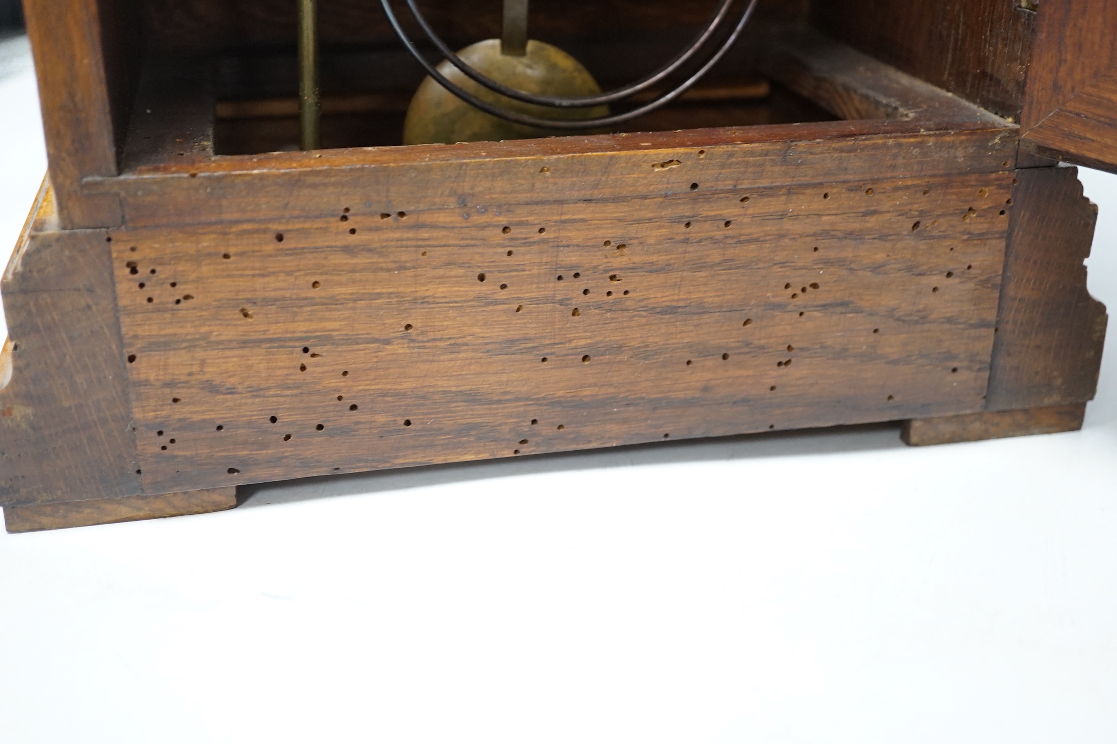 An Edwardian carved oak mantel clock with engraved dial, 33cm high